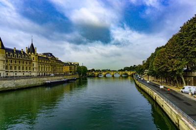 View of bridge over river against cloudy sky