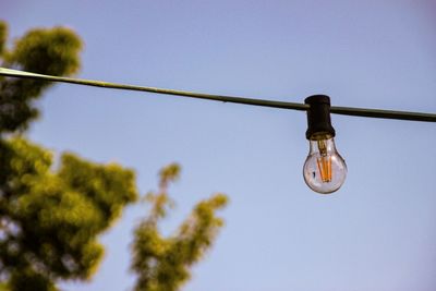 Low angle view of lighting equipment against clear sky