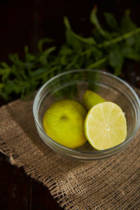 Exotic citrus - green sliced lime and mint on the foreground. green healthy food, diet. summer 