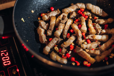 High angle view of meat in cooking pan