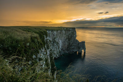 Scenic view of sea against sky at sunset