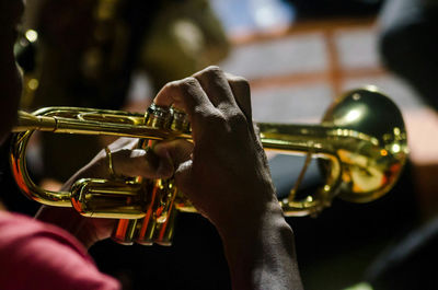 Cropped image of musician playing trumpet