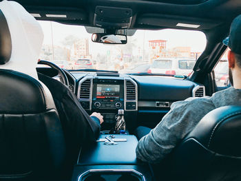 People sitting in car