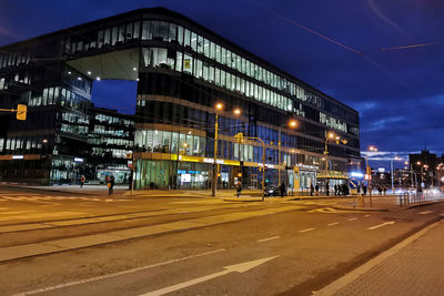 Illuminated city street at night