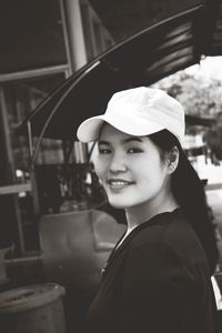 Portrait of smiling woman wearing cap