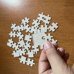 High angle view of human hand holding paper