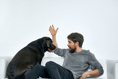 Man and dog looking at camera