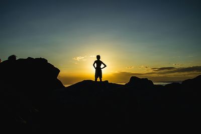 Silhouette of people at sunset