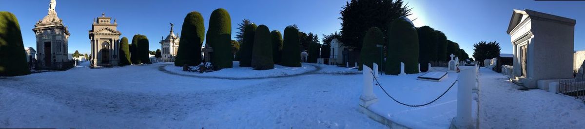 Panoramic view of snow covered footpath against sky