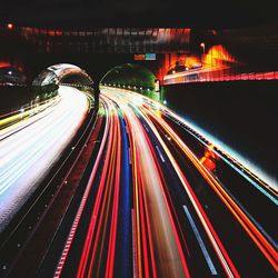 Light trails on road in city at night