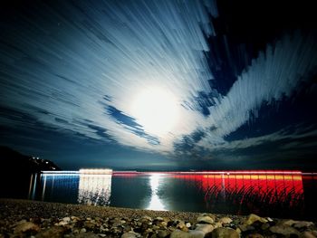 Scenic view of sea against sky at night