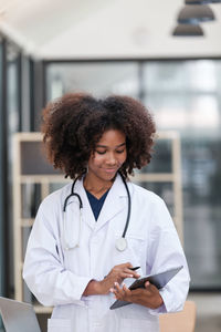 Portrait of female doctor holding stethoscope