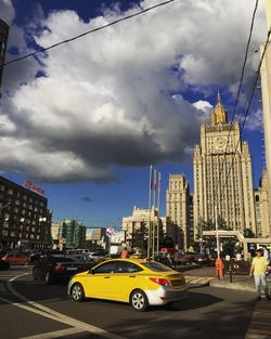City street against cloudy sky