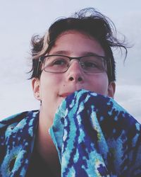 Portrait of boy wearing eyeglasses against sky