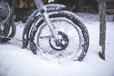 Close-up of bicycle wheel during winter