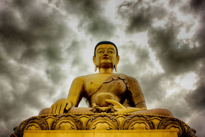 Low angle view of statue against sky