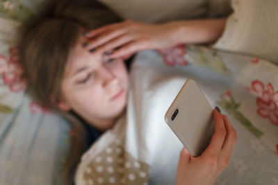 High angle view of woman using mobile phone