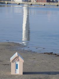 Model house on shore at beach