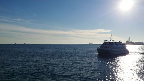 Boat sailing in sea against sky