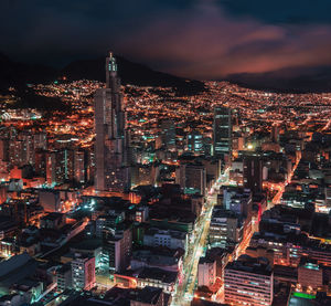 High angle view of illuminated city buildings at night