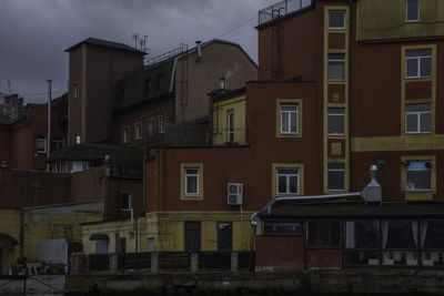 Houses against sky in city