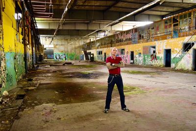 Full length of man standing in abandoned building