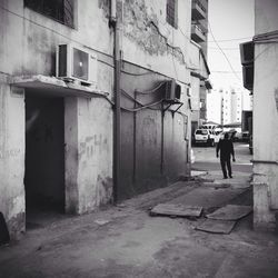 Rear view of woman walking on street