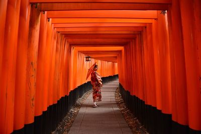 Full length of woman walking in temple