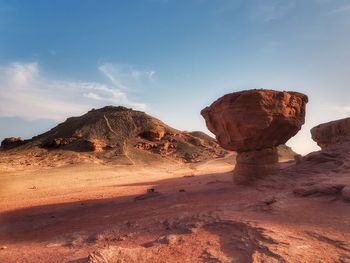 Rock formations in desert against sky