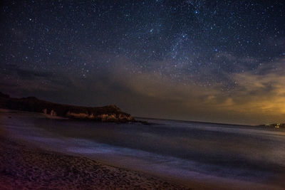 Scenic view of sea against sky at night