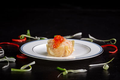 Close-up of dessert served on table