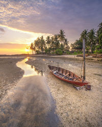 Scenic view of beach against sky during sunset