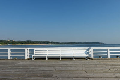 Scenic view of beach against clear blue sky