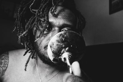 Close-up portrait of man holding ice cream