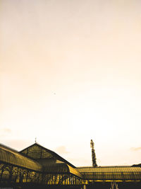 Low angle view of building against sky during sunset