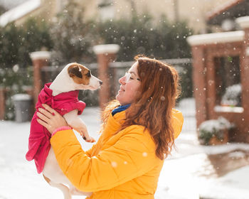 Side view of woman with dog