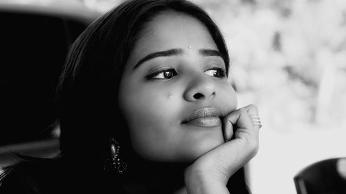 Close-up portrait of girl looking away