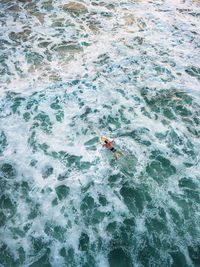 High angle view of man swimming in sea