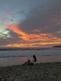 Scenic view of beach against sky during sunset