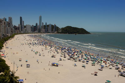 Panoramic view of beach against clear sky