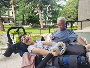 Portrait of man sitting on hammock