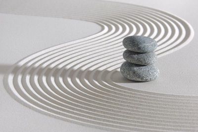 Japanese zen garden with stone in textured sand