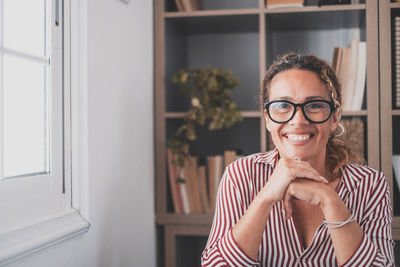 Portrait of smiling woman at home