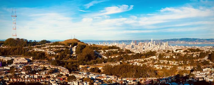 Panoramic view of city buildings against sky