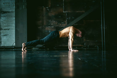 Full length of man surfing on floor