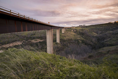 Bridge over land against sky