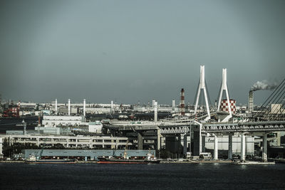 Commercial dock against sky in city