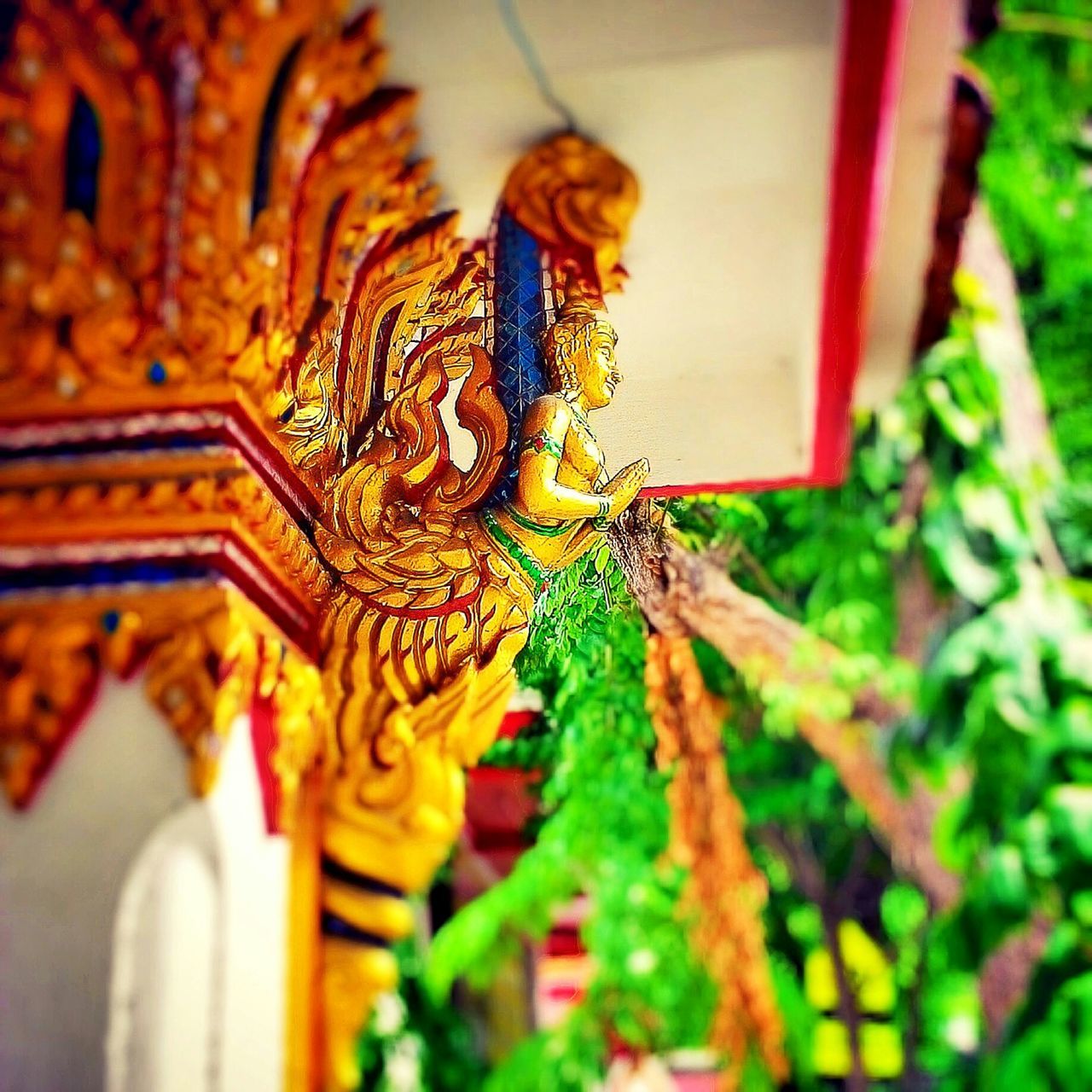 art and craft, art, selective focus, creativity, religion, focus on foreground, architecture, spirituality, sculpture, temple - building, built structure, place of worship, statue, indoors, gold colored, human representation, multi colored, building exterior, close-up