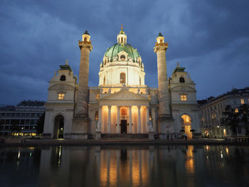 Low angle view of illuminated building against sky at night