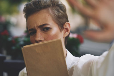 Close-up of man using laptop